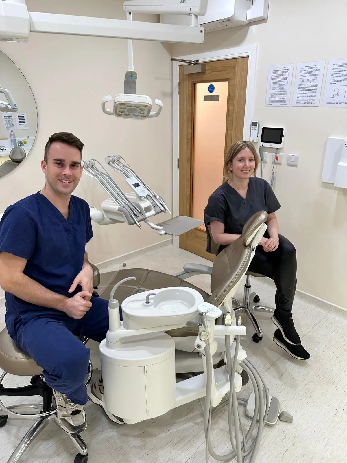 Dental nurse Lukasz and dentist Agata prepared for emergency dental care at Calm Dental clinic.